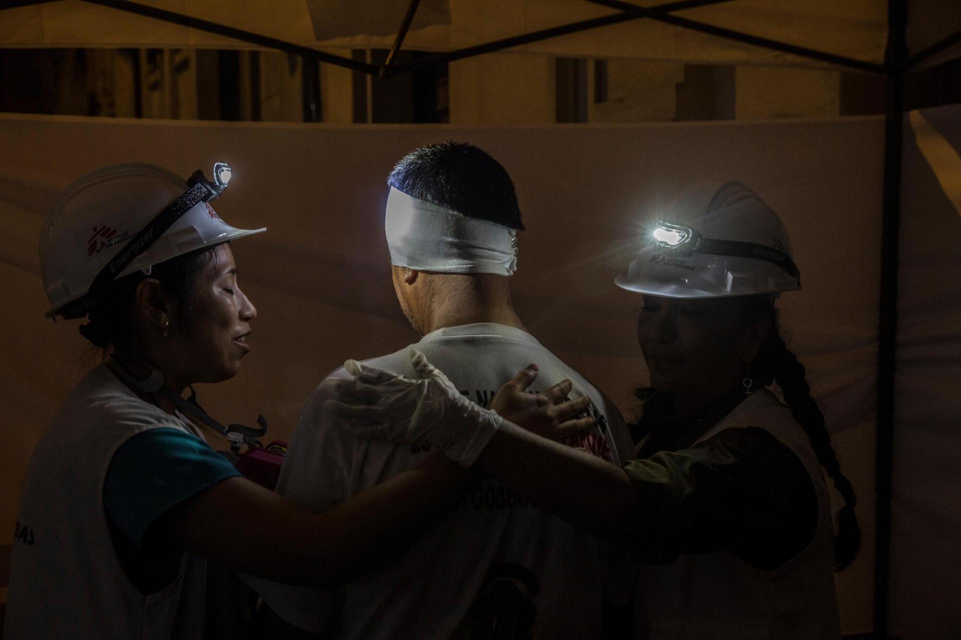 Treating people injured during the protests in Lima