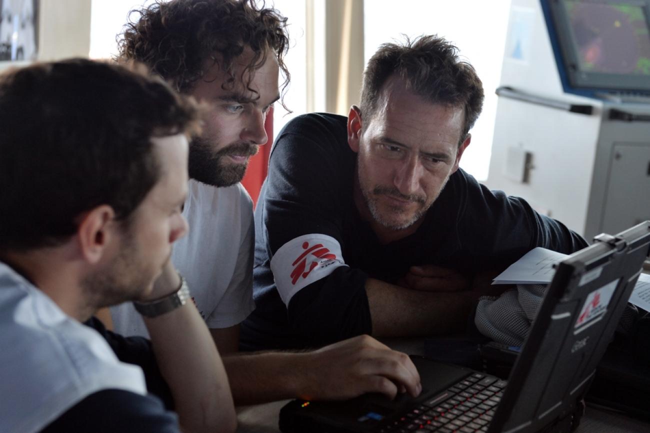 Wiet Vandormael, MSF Deputy Field Coordinator, Pierre Kernen, MSF logistician, and François Zamparini, MSF Field Coordinator discuss the SAR operations in the bridge of the Bourbon Argos