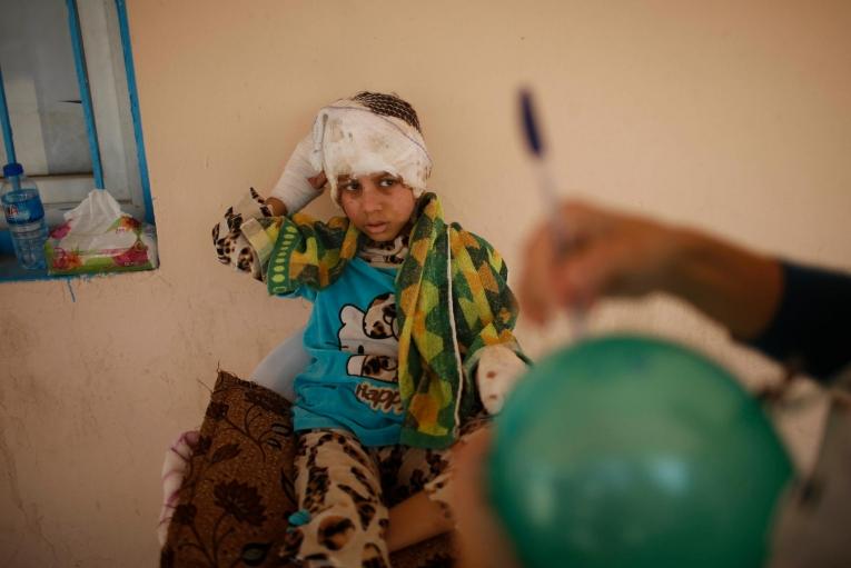 Douha, 8 ans, orpheline.
 © Suhaib Salem/REUTERS