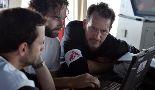 Wiet Vandormael, MSF Deputy Field Coordinator, Pierre Kernen, MSF logistician, and François Zamparini, MSF Field Coordinator discuss the SAR operations in the bridge of the Bourbon Argos